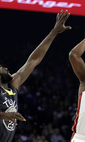 Cousins’ late free throws lead Warriors past Heat 120-118